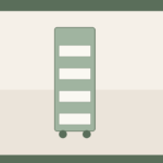 Narrow freestanding kitchen trolley with baskets in a tiny flat galley gap