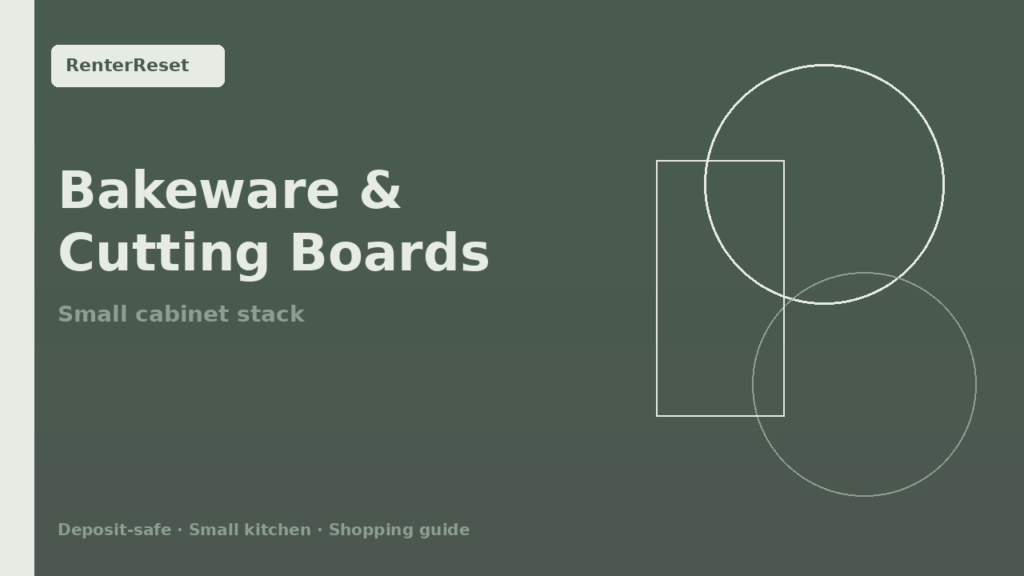 Vertical bakeware and cutting board organizer inside a small rental kitchen cabinet