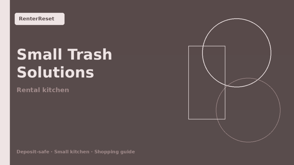 Slim trash can tucked beside cabinets in a small rental kitchen