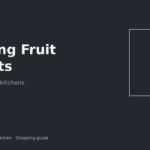 Hanging fruit basket with bananas and citrus in a tiny apartment kitchen