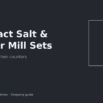Compact salt and pepper mill set beside a stove in a small rental kitchen