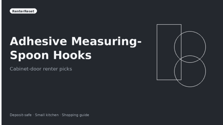 Measuring spoons hanging on adhesive hooks inside a rental kitchen cabinet door