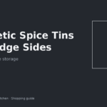Magnetic spice tins lined up on the side of an apartment fridge